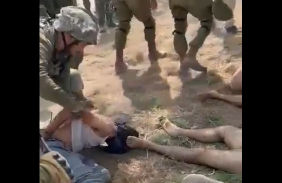 Shocking visuals : Israeli soldiers blindfolded Palestinians and drag them:  Another Killing Field
